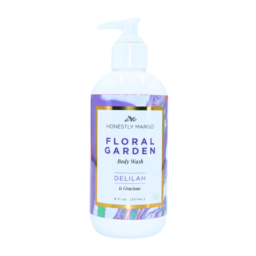 Body wash bottle with floral design label on a white background. Available at Be Charmed