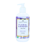 Body wash bottle with floral design label on a white background. Available at Be Charmed