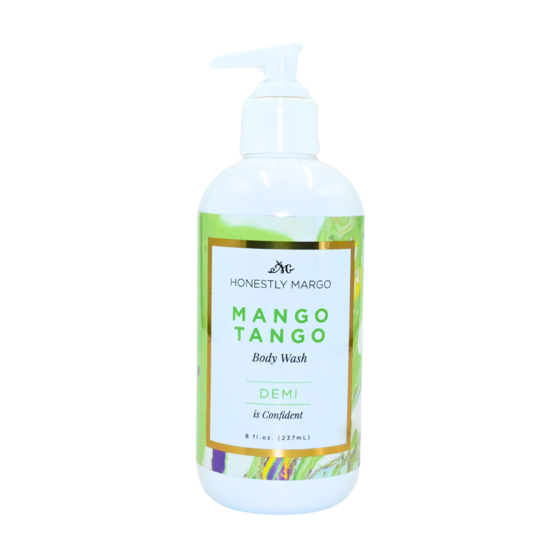 Body wash bottle labeled 'Honestly Marco Mango Tango' on a white background. Available at Be Charmed