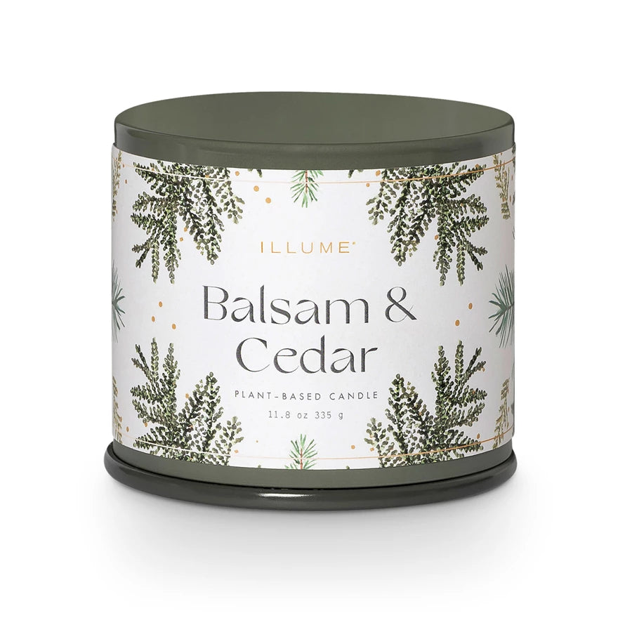 Candle with 'Balsam & Cedar' label on a white background. Available at Be Charmed
