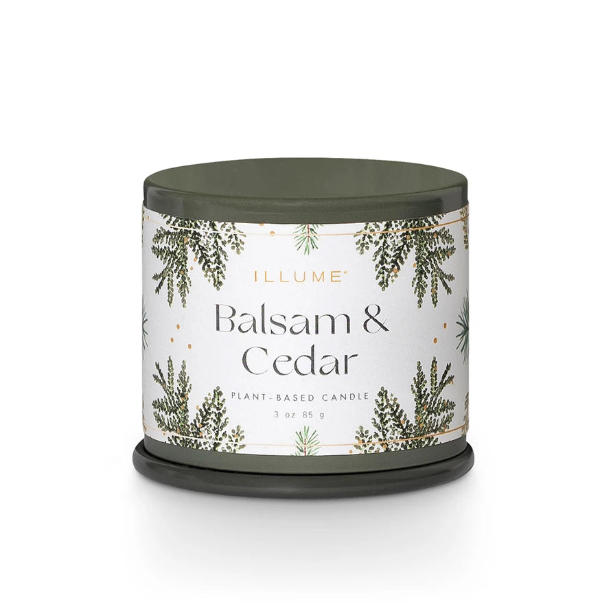 Candle with 'Balsam & Cedar' label on a white background. Available at Be Charmed