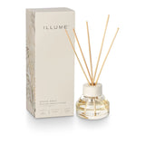ILLUME diffuser bottle with reeds and packaging on a white background. Available at Be Charmed