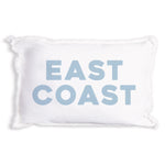 A Rustic Marlin white rectangular throw pillow with frayed edges and the words 'EAST COAST' printed in large, light blue block letters on the front, set against a plain white background. Available at Be Charmed