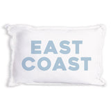 A Rustic Marlin white rectangular throw pillow with frayed edges and the words 'EAST COAST' printed in large, light blue block letters on the front, set against a plain white background. Available at Be Charmed