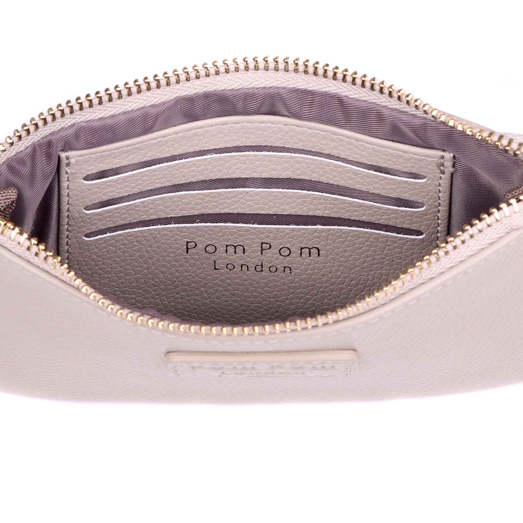 Inside Pom Pom London Chelsea Coin Purse – premium handcrafted leather zip purse for coins and cards. Compact and stylish. Available at Be Charmed.
