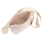 Beige quilted waist bag with gold accents on a white background