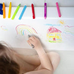 Kid using Tiger Tribe Bath Crayons set with colorful, washable crayons designed for drawing on tub walls during bath time. Safe and fun for kids. Available at Be Charmed.