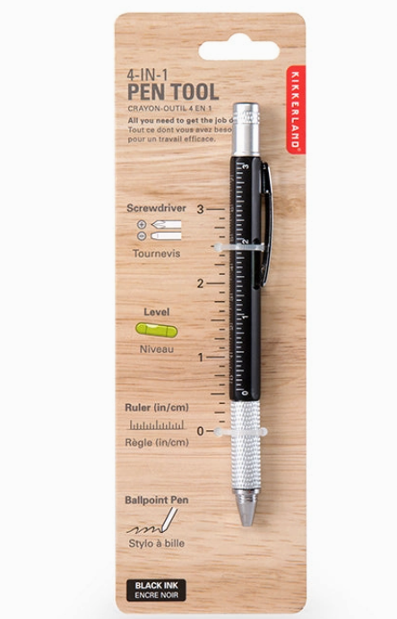 4-in-1 pen tool with ruler, screwdriver, level, and ballpoint pen on wooden packaging. Available at Be Charmed. 