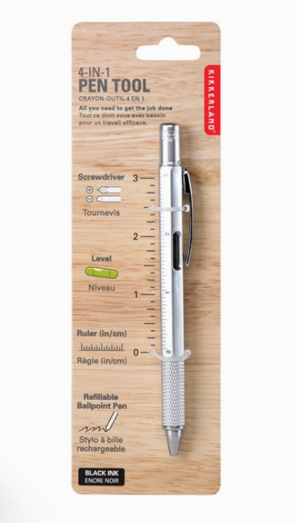 Multifunctional pen tool with ruler on a wooden backing. Available at Be Charmed. 