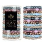 Stack of colorful hair ties with a container labeled 'Grab & Go Pony' on a white background. Available at Be Charmed
