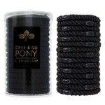Black hair ties in a clear container with L. Erickson branding on a white background. Available at Be Charmed