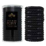 Black hair ties in a clear container with L. Erickson branding on a white background. Available at Be Charmed