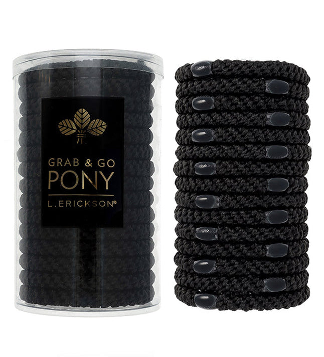 Black hair ties in a clear container with L. Erickson branding on a white background. Available at Be Charmed