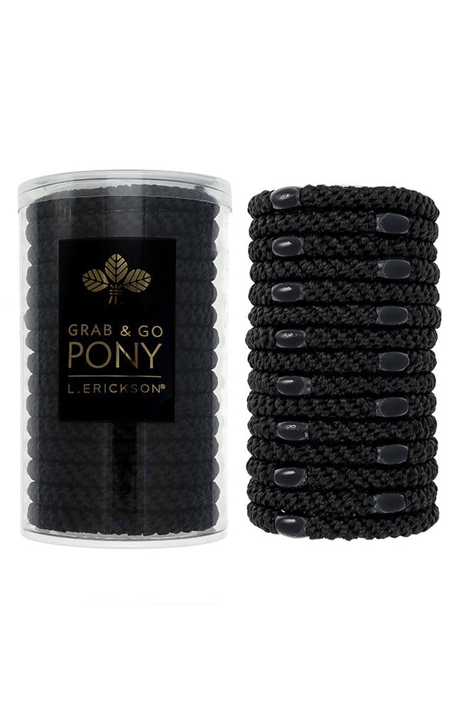 Black hair ties in a clear container with L. Erickson branding on a white background. Available at Be Charmed