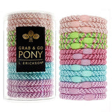 A clear tube containing Cabana ponytail holders with ornamental oval beads, labeled 'Grab & Go Pony' by L. Erickson.