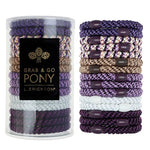 Set of purple and gold hair ties with a cylindrical container labeled 'Grab & Go Pony' on a white background. Available at Be Charmed