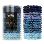 Blue hair ties in a cylindrical container with L Erickson branding on a white background. Available at Be Charmed