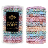 L. Erickson Grab & Go Pony Tube in Tutu. Set of 15 no-damage ponytail holders in soft pink and blush tones. Available at Be Charmed.