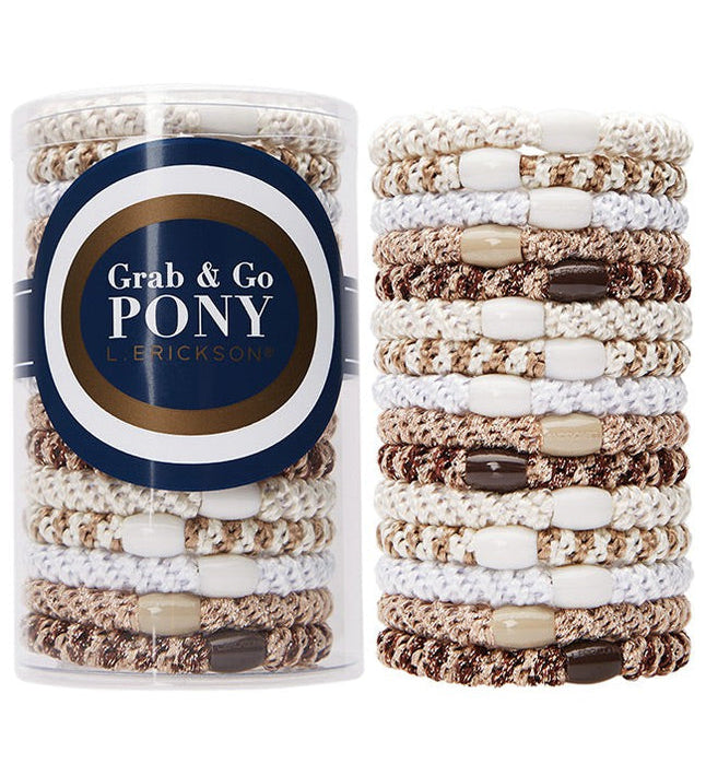 Packaged hair ties with 'Grab & Go Pony' label on a white background. Available at Be Charmed