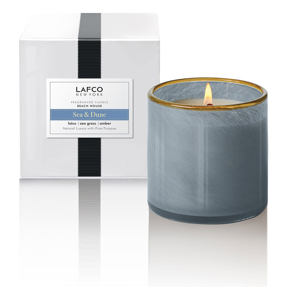 A luxury LAFCO Beach House Sea and Dune 15.5 oz soy wax candle in a hand-blown artisan glass vessel, available at Be Charmed.