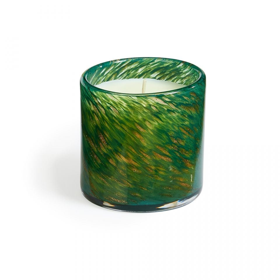 A cylindrical candle with a green and brown marbled pattern on a clear glass base. Available at Be Chrmed
