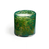 A cylindrical candle with a green and brown marbled pattern on a clear glass base. Available at Be Chrmed