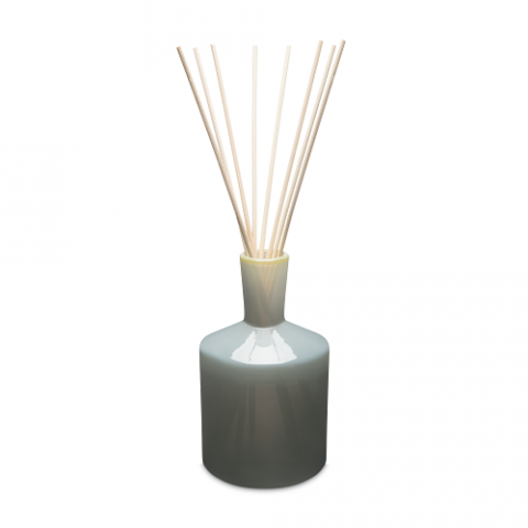 A LAFCO reed diffuser with a grey ceramic bottle and several light wooden reeds inserted, against a white background. Available at Be Charmed