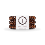 Large Tortoise Teleties Hair Ties—strong grip, waterproof, no crease—available at Be Charmed.