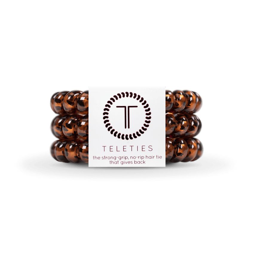 Large Tortoise Teleties Hair Ties—strong grip, waterproof, no crease—available at Be Charmed.