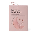 Pink satin pillowcase packaging with moon and star designs on box on a white background. Available at Be Charmed