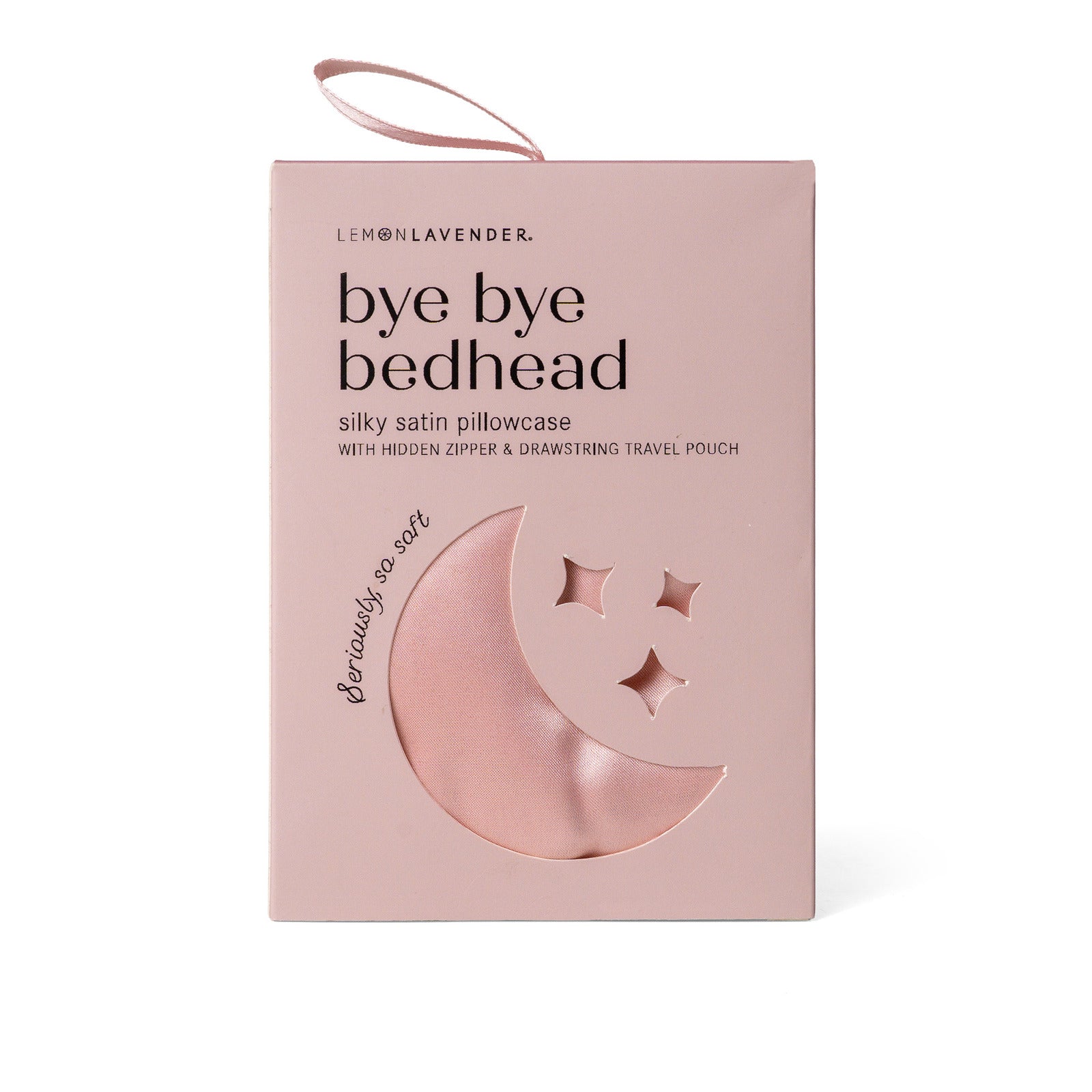 Pink satin pillowcase packaging with moon and star designs on box on a white background. Available at Be Charmed