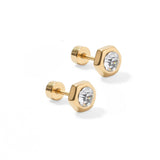Pair of gold stud earrings with clear gemstones on a white background. Available at Be Charmed