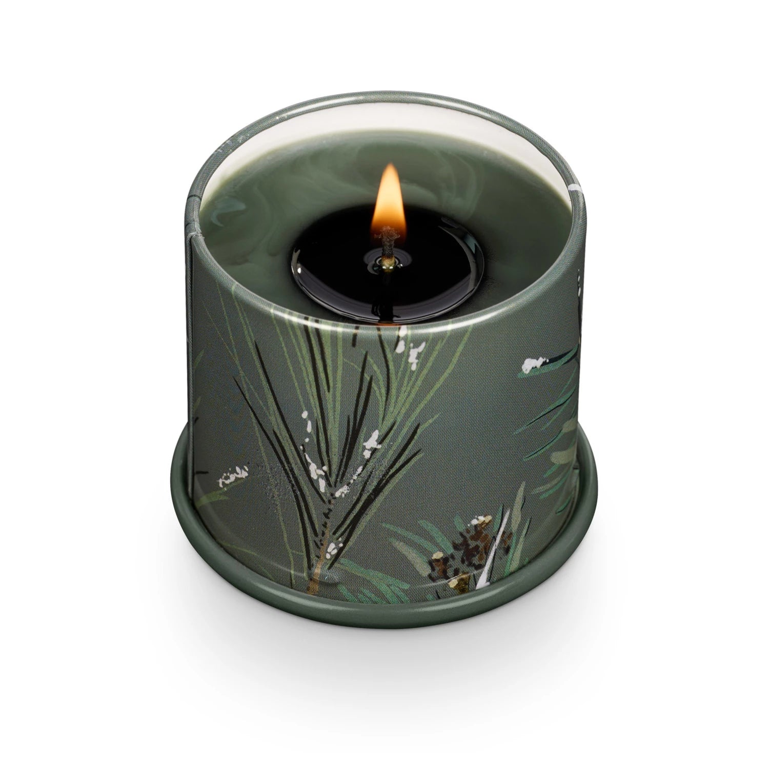 Candle in a green container with floral design on a white background. Available at Be Charmed