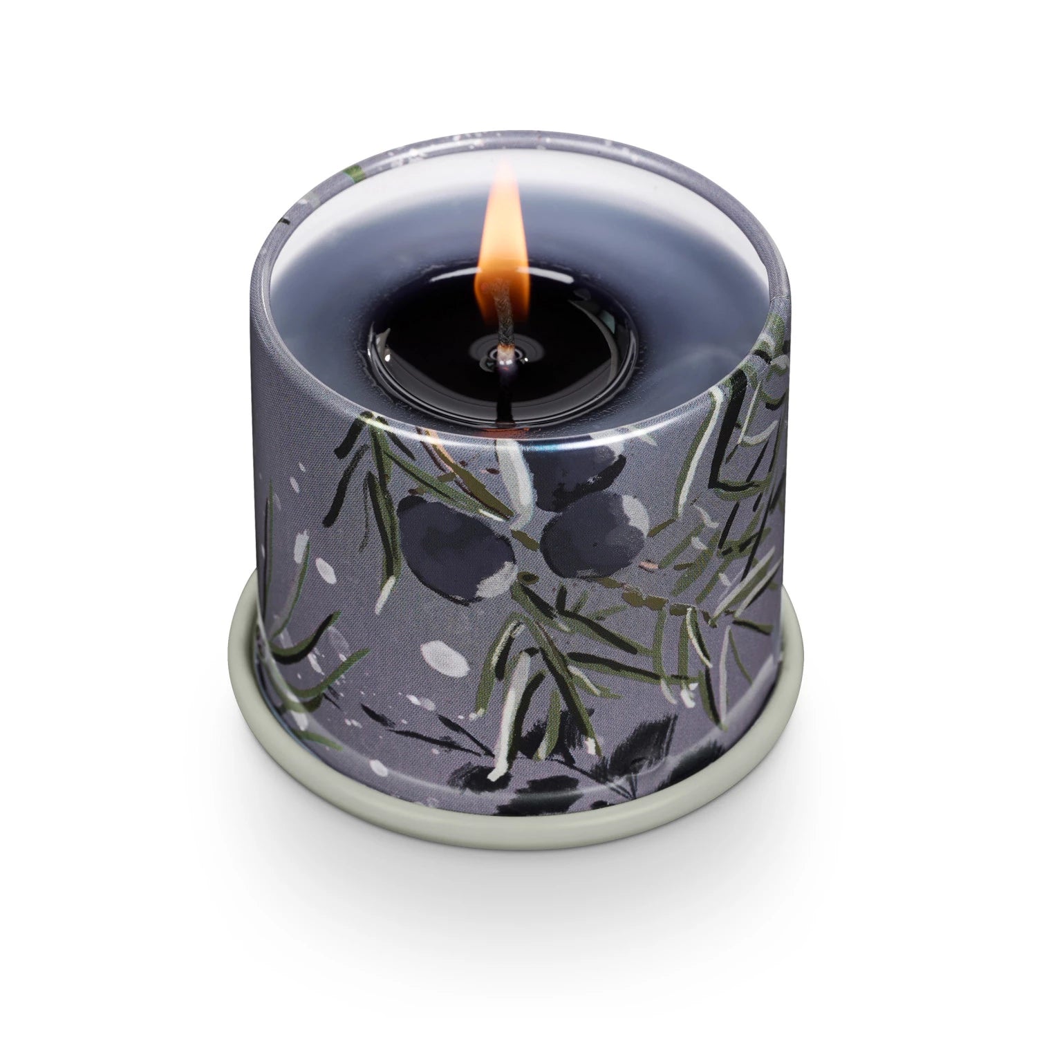 Candle in a decorative container with floral pattern on a white background. Available at Be Charmed