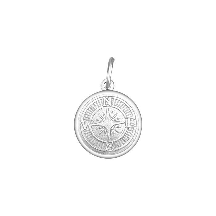 A sterling silver pendant with a allpine white enamel inlay designed to resemble a compass. Available at Be Charmed