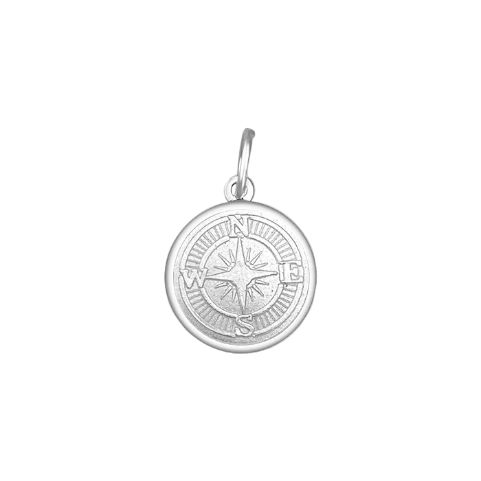 A sterling silver pendant with a allpine white enamel inlay designed to resemble a compass. Available at Be Charmed