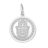 A Lola sterling silver pendant with an alpine white center featuring the Hamsa Hand, with enamel inlay. Available at Be Charmed