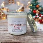 Lola & Bean 7.5 oz Soy Candle in Gingerbread House — warm cinnamon, clove, and vanilla scent in a clean-burning jar. Available at Be Charmed