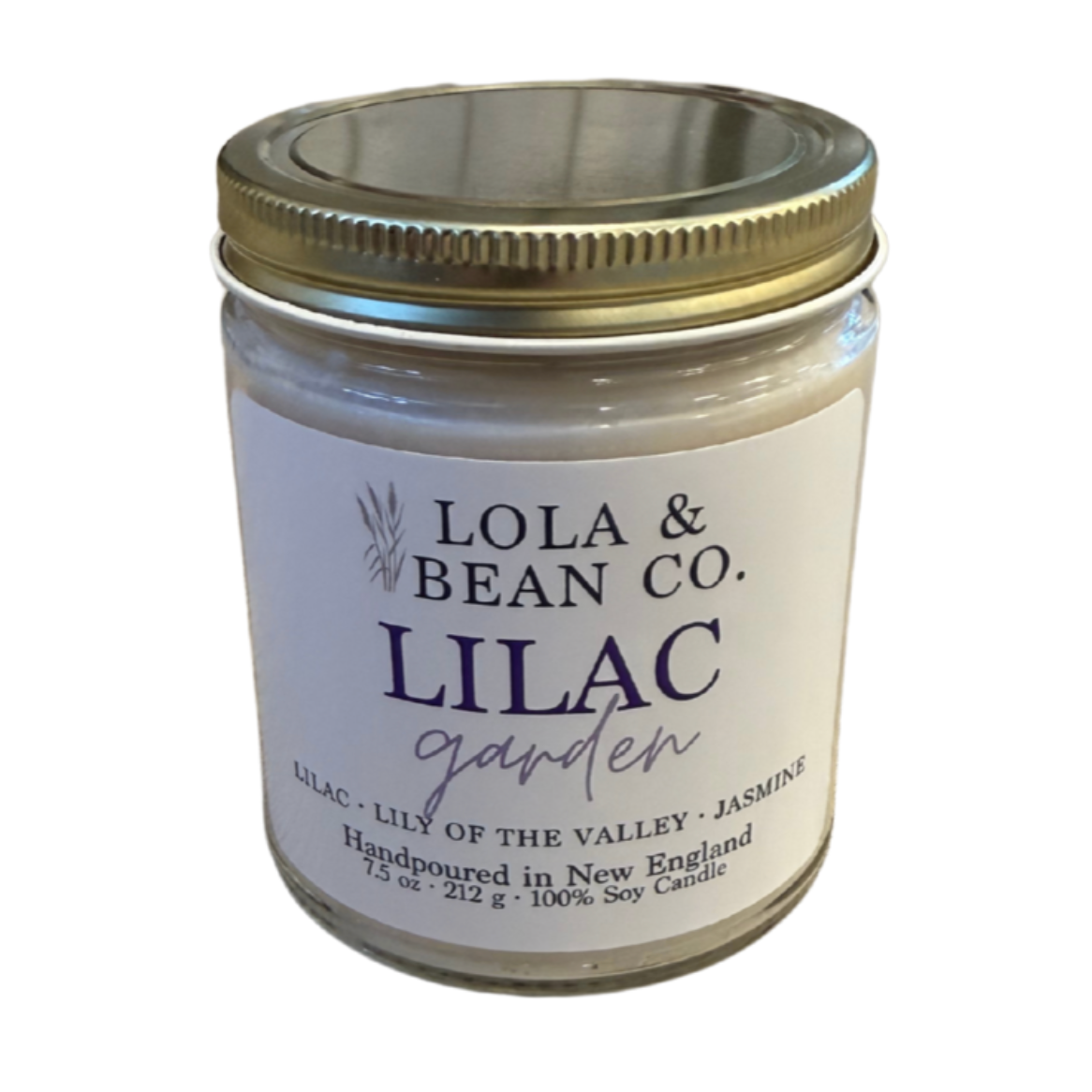 A jar candle with a white label that reads 'LILAC GARDEN' by Lola & Bean Co. Available at Be Charmed