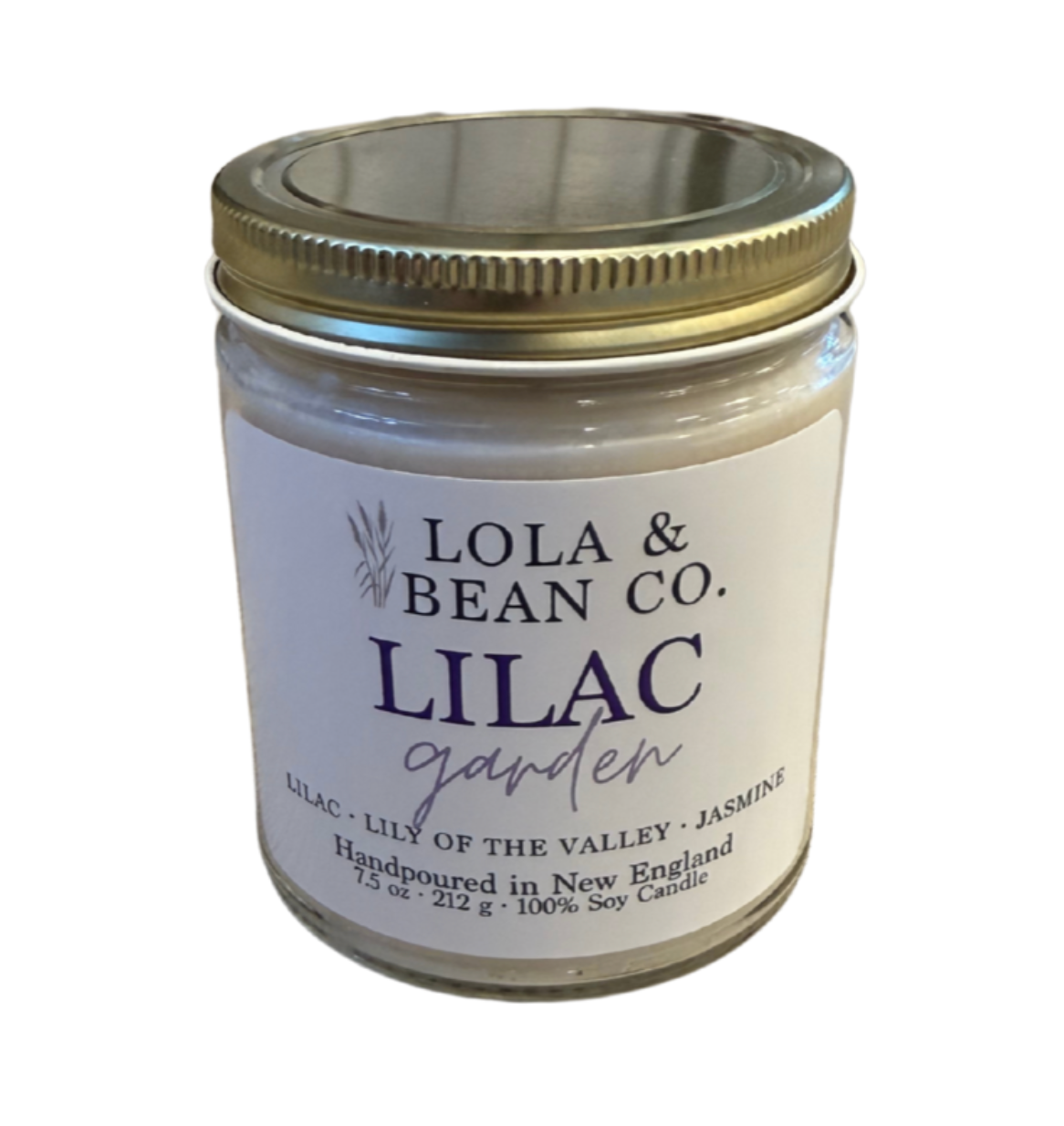 A jar candle with a white label that reads 'LILAC GARDEN' by Lola & Bean Co. Available at Be Charmed