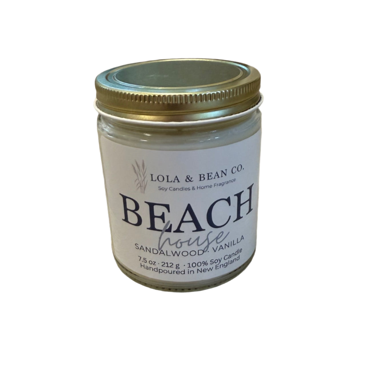 Lola & Bean Beach House 7.5 oz Soy Candle – White glass jar with wooden lid, featuring a coastal-inspired scent, available at Be Charmed.