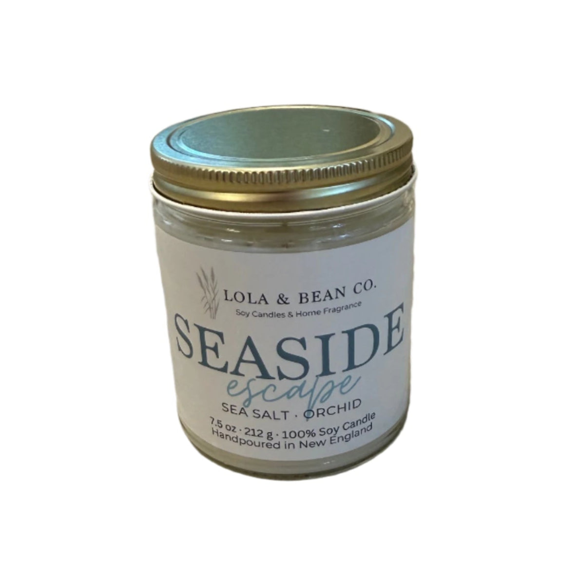 Lola & Bean Seaside Escape 7.5 oz Soy Candle – White glass jar with ocean-inspired label, featuring a fresh ocean breeze scent, available at Be Charmed.