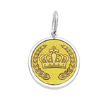 A Lola sterling silver pendant with a gold vermeil center featuring a crown design and the engraved text 'GRIT & GRACE' on the back. Available at Be Charmed