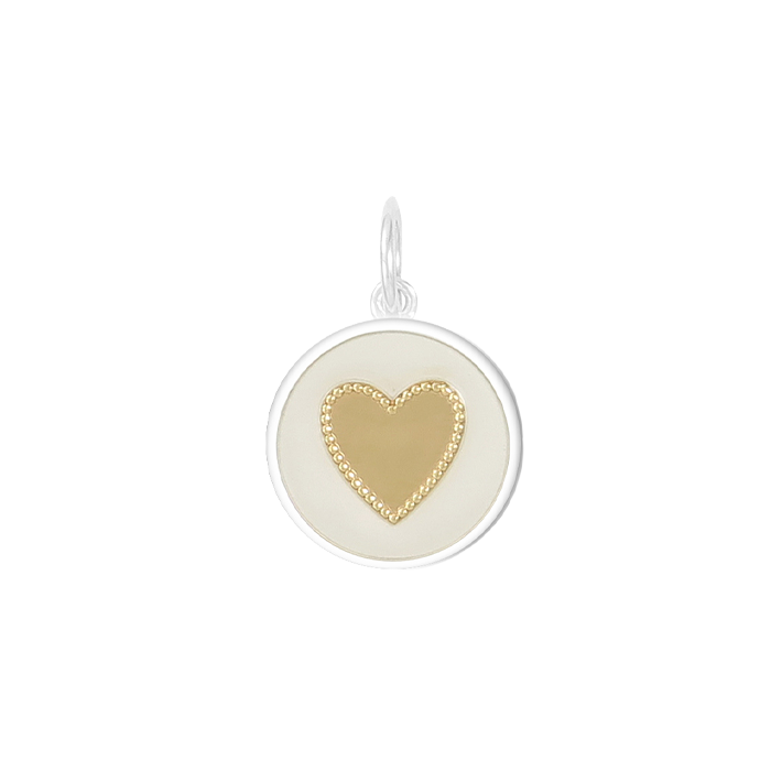 A Lola heart-shaped pendant with a Gold Vermeil and white color scheme. Available at Be Charmed