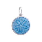 A sterling silver pendant with a light blue enamel inlay, featuring an engraved design resembling a sand dollar. Available at Be Charmed