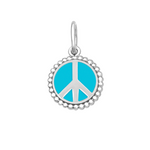 A sterling silver peace sign pendant with a turquoise enamel inlay and beaded border. Available at Be Charmed