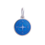 A sterling silver pendant with a blue enamel inlay designed to resemble a compass. Availble at Be Charmed
