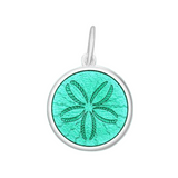 A sterling silver pendant with a seafoam enamel inlay, featuring an engraved design resembling a sand dollar. Available at Be Charmed