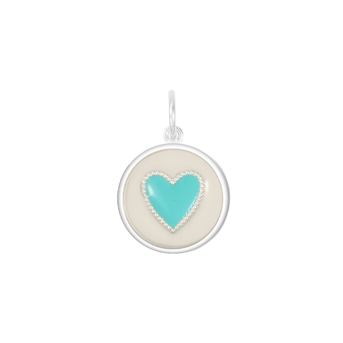 A Lola heart-shaped pendant with a Turquoise and white color scheme. Available at Be Charmed