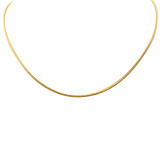 A gold wheat chain necklace with a thin design, likely made from 24 karat gold plate over 925 sterling silver. Available at Be Charmed